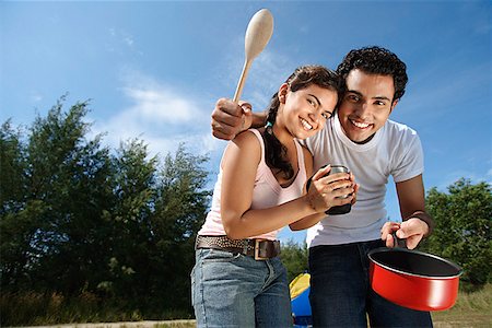 Young couple camping and cooking in the wilderness Stock Photo - Premium Royalty-Free, Code: 655-01781517