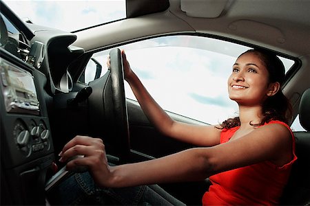 driving in asia - Young woman driving car Stock Photo - Premium Royalty-Free, Code: 655-01781538