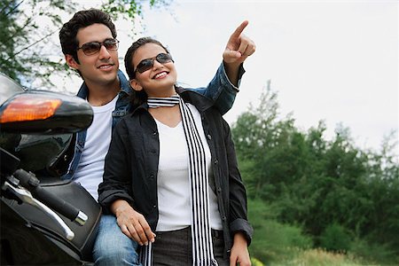 simsearch:614-06896253,k - Young couple with motorbike Stock Photo - Premium Royalty-Free, Code: 655-01781626