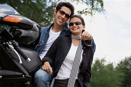 simsearch:614-06896253,k - Young couple with motorbike Stock Photo - Premium Royalty-Free, Code: 655-01781683