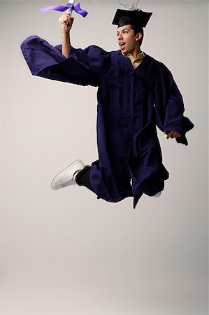 Graduate jumping for joy Stock Photo - Premium Royalty-Free, Code: 655-02375782