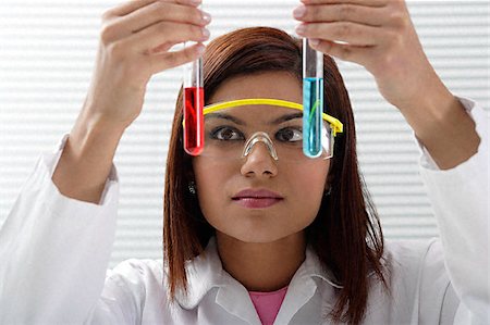 Scientist with holding two viles Stock Photo - Premium Royalty-Free, Code: 655-02375847
