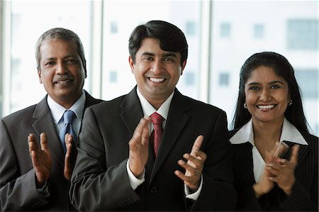 simsearch:655-03458001,k - Indian people clapping and smiling Stock Photo - Premium Royalty-Free, Code: 655-03457887