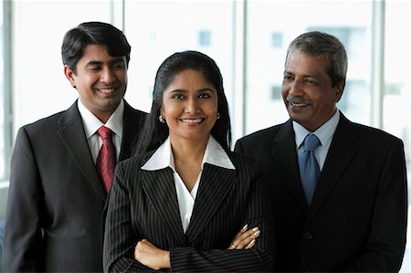 simsearch:655-03458001,k - Two business men looking at their female colleague Stock Photo - Premium Royalty-Free, Code: 655-03457929