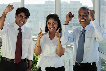 simsearch:655-03458001,k - Three Indian people smiling making hand gestures Stock Photo - Premium Royalty-Free, Code: 655-03457957