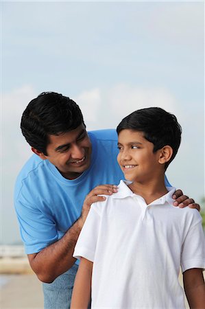 Father looking at son and smiling Stock Photo - Premium Royalty-Free, Code: 655-03457979