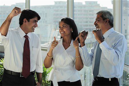 simsearch:655-03458001,k - Three Indian people smiling at each other and making hand gestures Stock Photo - Premium Royalty-Free, Code: 655-03457980