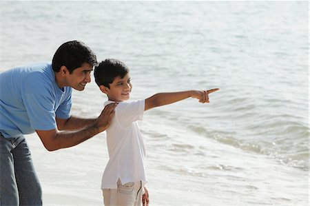 Father and son looking at the ocean. Stock Photo - Premium Royalty-Free, Code: 655-03458026