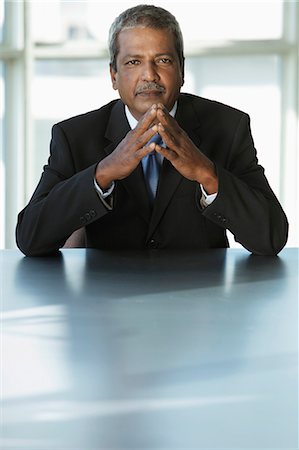 simsearch:655-03458001,k - Indian business man sitting at table Stock Photo - Premium Royalty-Free, Code: 655-03458030