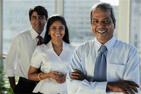 simsearch:655-03458001,k - Three Indian business people smiling together Stock Photo - Premium Royalty-Free, Code: 655-03458063