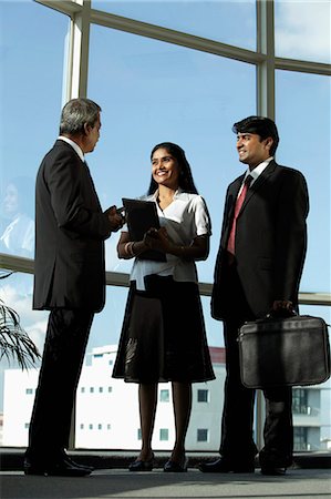 simsearch:655-03458001,k - Three Indian people in business suits talking together Stock Photo - Premium Royalty-Free, Code: 655-03458073