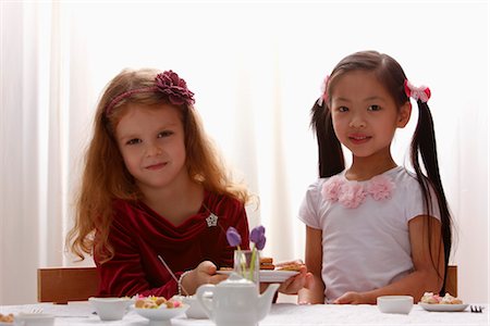 two young girls playing together Stock Photo - Premium Royalty-Free, Code: 656-04926548