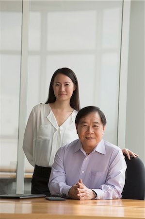 simsearch:656-03241003,k - Singapore, Portrait of two business people in office Stock Photo - Premium Royalty-Free, Code: 656-08349926