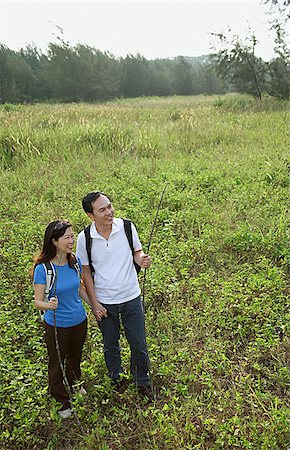 Man and woman hiking in nature, outdoors Stock Photo - Premium Royalty-Free, Code: 656-01765193