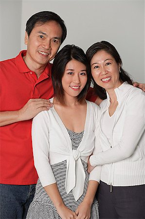 simsearch:841-02720357,k - Family of three, looking at camera, smiling Stock Photo - Premium Royalty-Free, Code: 656-01765648