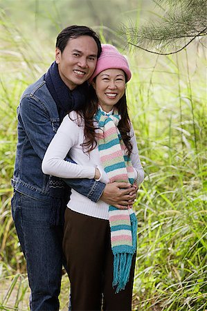 simsearch:841-02720357,k - Man and woman wearing hat and scarves, standing outdoors in nature Stock Photo - Premium Royalty-Free, Code: 656-01765675