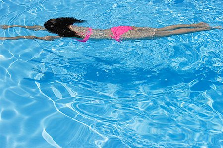 Woman swimming in pool Stock Photo - Premium Royalty-Free, Code: 656-01765770
