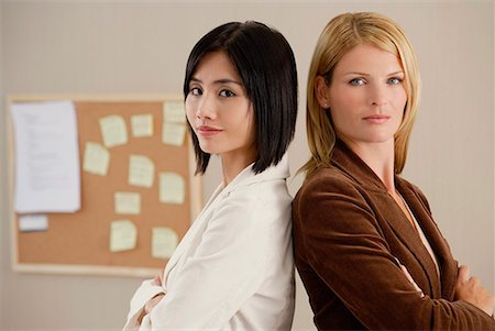 employer - Two female colleagues look at the camera together Stock Photo - Premium Royalty-Free, Code: 656-01766388