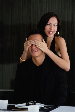 front of expensive house - A woman covers her boyfriends eyes as she prepares to surprise him with dinner Stock Photo - Premium Royalty-Free, Code: 656-01766574