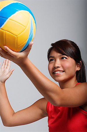 simsearch:858-03050428,k - Young woman playing with volleyball Stock Photo - Premium Royalty-Free, Code: 656-01766803