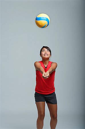 simsearch:858-03050428,k - Young woman playing with volleyball Stock Photo - Premium Royalty-Free, Code: 656-01767000