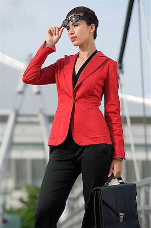 Businesswoman looking into distance Stock Photo - Premium Royalty-Free, Code: 656-01767103