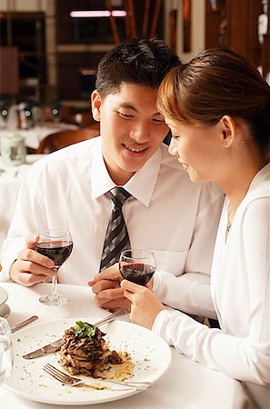 fancy restaurant - Couple in restaurant, sitting side by side, holding hands Stock Photo - Premium Royalty-Free, Code: 656-01768489