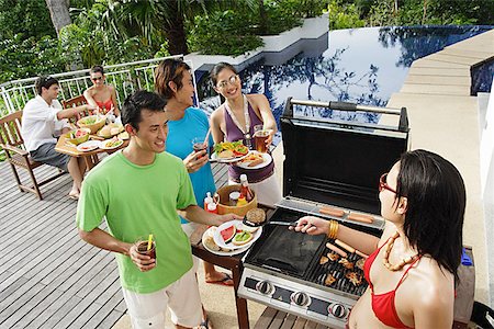 friends cooking inside - Friends at barbeque party Stock Photo - Premium Royalty-Free, Code: 656-01770184