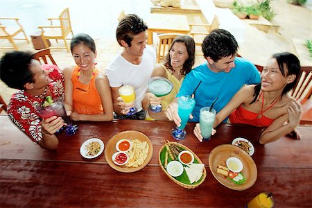 Young adults at beach bar, high angle view Stock Photo - Premium Royalty-Free, Code: 656-01770349