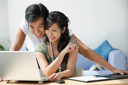 Young couple working at computer Stock Photo - Premium Royalty-Free, Code: 656-02371784