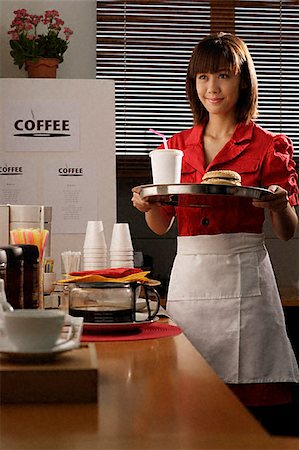 Waitress in diner serving burger and drink Stock Photo - Premium Royalty-Free, Code: 656-02371856