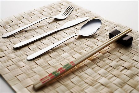 fork, knife, spoon and chopstick dinner setting Stock Photo - Premium Royalty-Free, Code: 656-02702856