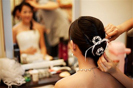 Woman getting hair done Stock Photo - Premium Royalty-Free, Code: 656-02879699