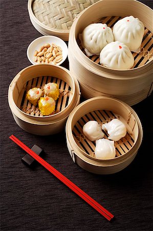 Assortment of dim sum in bamboo steamers. Stock Photo - Premium Royalty-Free, Code: 656-03076278