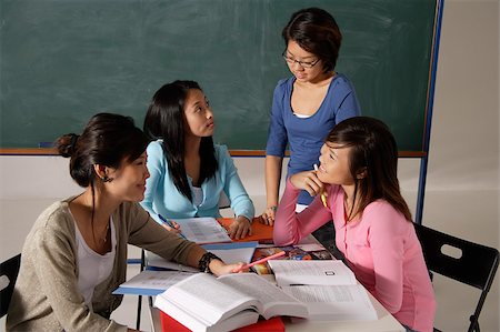 Four women studying together. Stock Photo - Premium Royalty-Free, Code: 656-03076282