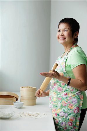 Mature Chinese woman making Dim Sum Stock Photo - Premium Royalty-Free, Code: 656-03519512