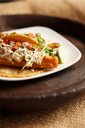 simsearch:659-06372915,k - Baja Taco; Fried Tilapia Taco in a Corn Tortilla with Slaw and Salsa Stock Photo - Premium Royalty-Free, Code: 659-06154254