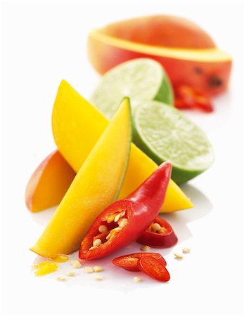 food still life - Mango, limes and chili peppers Stock Photo - Premium Royalty-Free, Code: 659-06154276