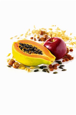 simsearch:659-07027144,k - Ingredients for müsli: papaya, apple, nuts, pumpkin seeds and raisins Stock Photo - Premium Royalty-Free, Code: 659-06154286