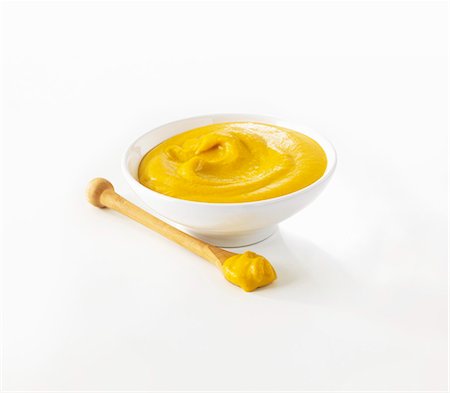 Mustard in small pot and on spoon Foto de stock - Sin royalties Premium, Código: 659-06154290