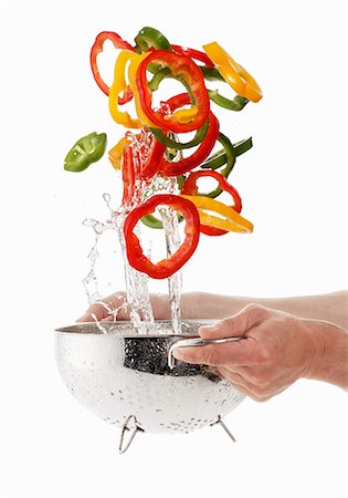 Pepper rings being washed Stock Photo - Premium Royalty-Free, Code: 659-06154337