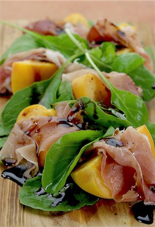 simsearch:659-07597225,k - Peaches wrapped in prociutto with rocket and balsamic vinegar Stock Photo - Premium Royalty-Free, Code: 659-06154397