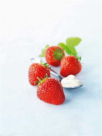 simsearch:659-06186270,k - Four strawberries and a spoonful of cream Stock Photo - Premium Royalty-Free, Code: 659-06154646