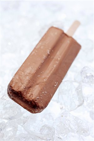 Chocolate-coated ice cream on a stick Stock Photo - Premium Royalty-Free, Code: 659-06154739