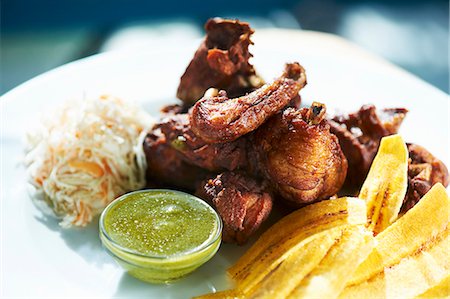 south america - Chicharron de Pollo (Deep Fried Chicken) with Plantain Chips Stock Photo - Premium Royalty-Free, Code: 659-06154979