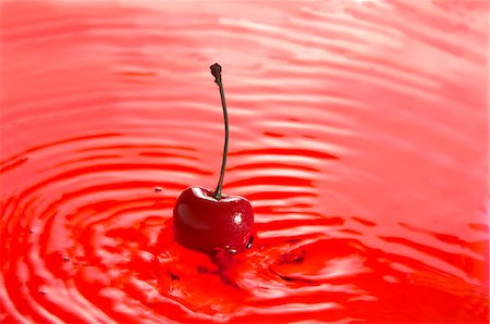 simsearch:659-07597339,k - A red cherry in cherry juice Stock Photo - Premium Royalty-Free, Code: 659-06155109