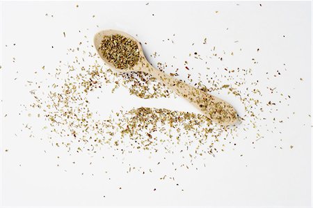 Dried oregano on a spoon and next to it Stock Photo - Premium Royalty-Free, Code: 659-06151880