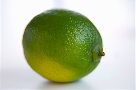 entirely - Whole Lime with Water Drops on a Black Background Stock Photo - Premium Royalty-Free, Code: 659-06152159