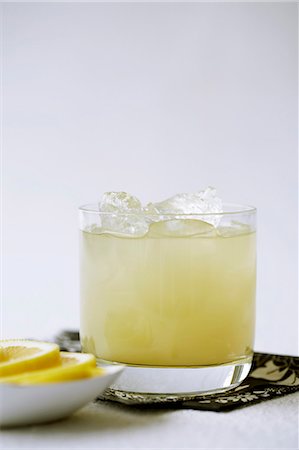 pineapple - Pineapple Juice with Rum Over Ice in Glass Stock Photo - Premium Royalty-Free, Code: 659-06152511