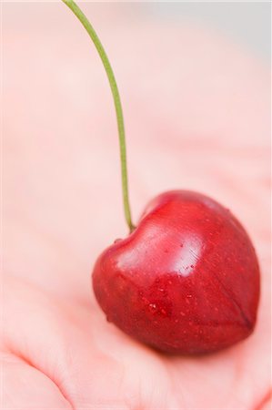 simsearch:659-07597339,k - A cherry on a hand (close-up) Stock Photo - Premium Royalty-Free, Code: 659-06152896